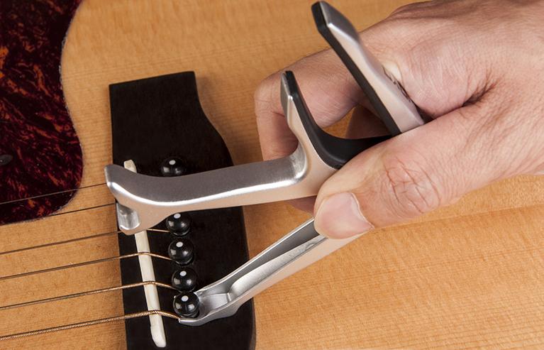Joyo JCP-02 Multifunction Guitar Capo + Bottle Opener & Bridge Pin Puller - Image 4